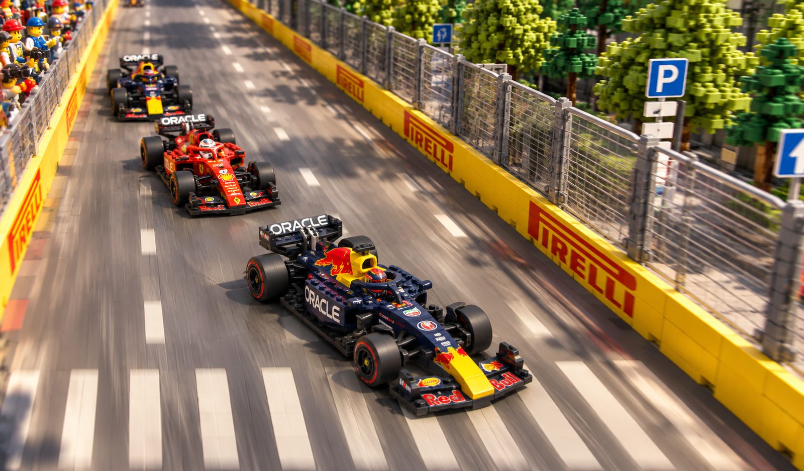 A Red Bull leading a Ferrari and a second Red Bull along a straight lined with Pirelli barriers.