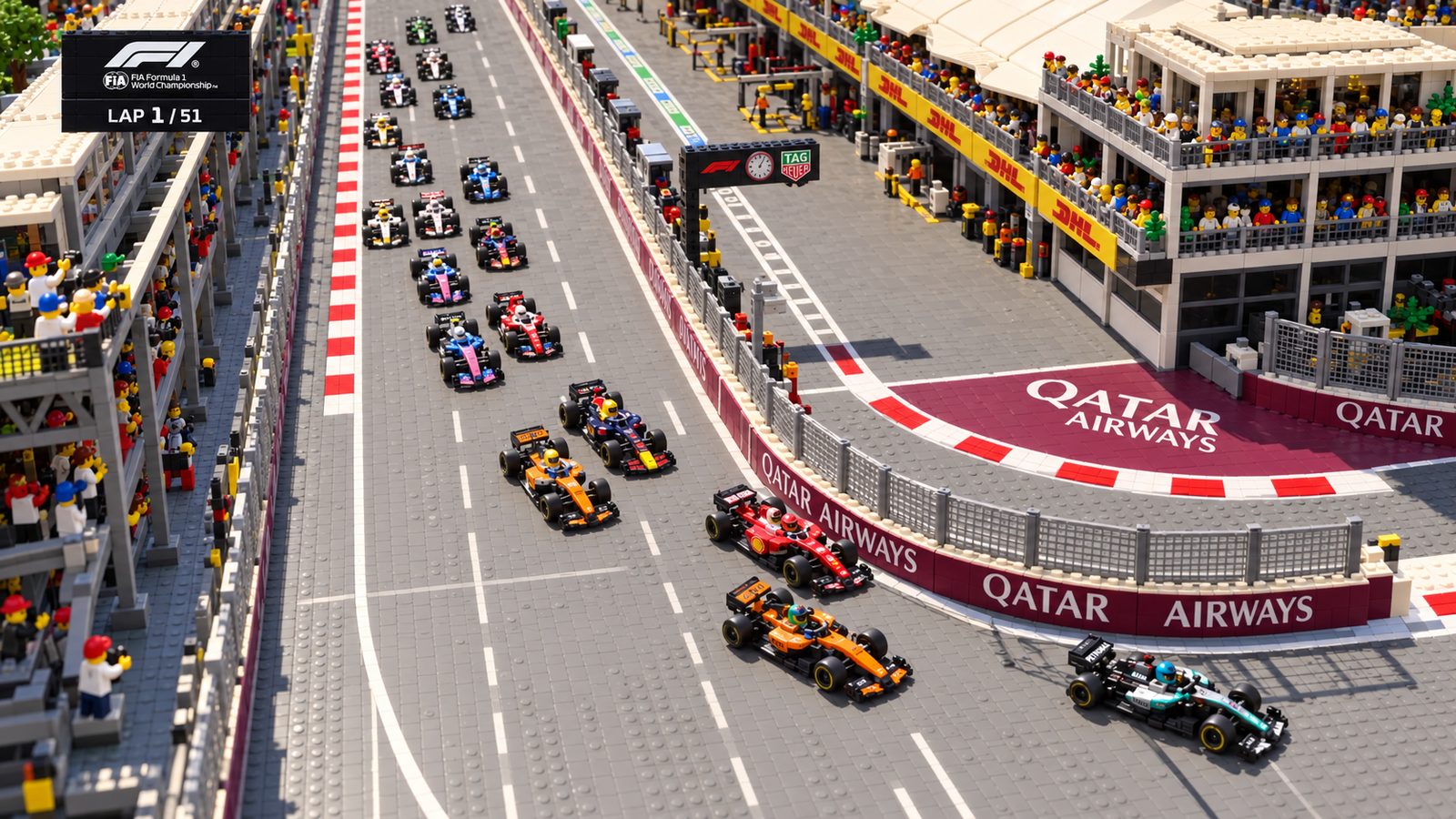 The Baku grid streaming towards Turn 1 on lap 1, cars two abreast between the pit wall and the barriers.